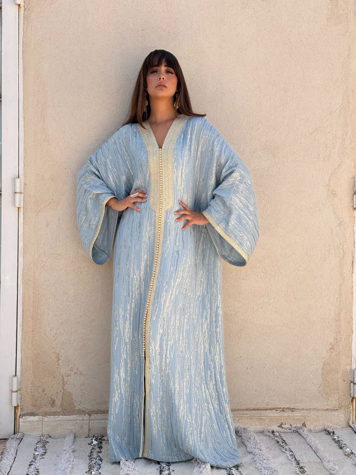Souhaila blue kaftan with shimmering pattern and cream trim, full front view